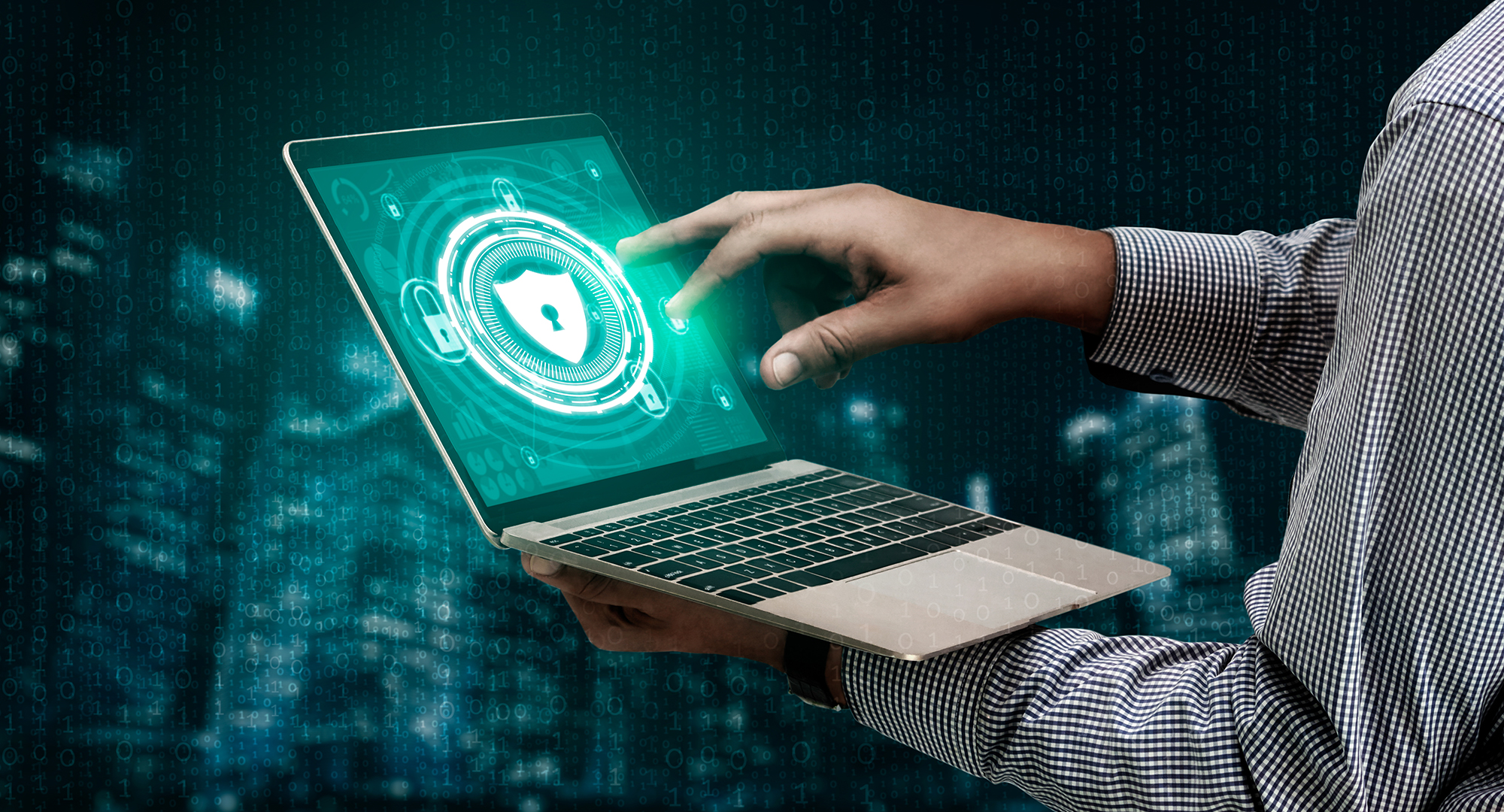 A professional looks at security software on his laptop.